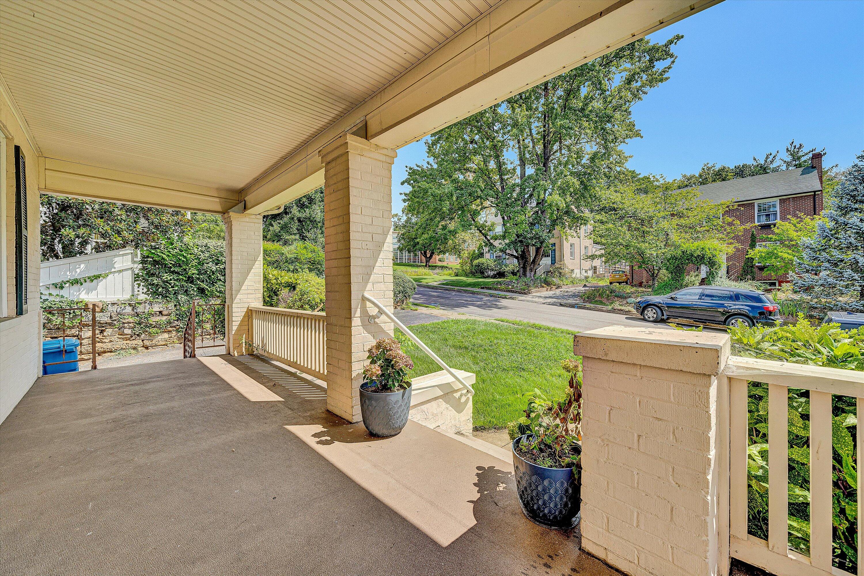 1907 Canterbury Road Southwest Roanoke, VA 24015 - Photo 3 of 36 a view of a porch with furniture and garden