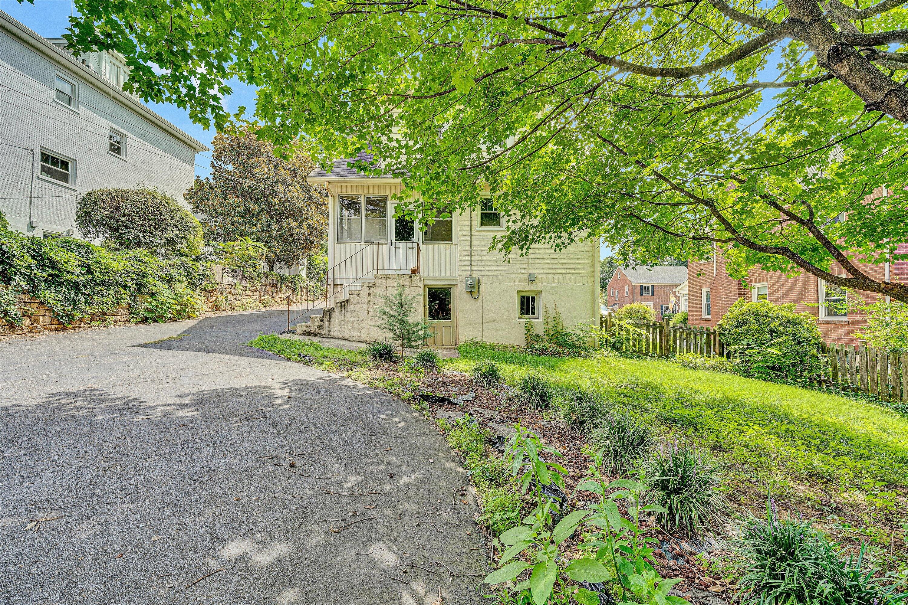 1907 Canterbury Road Southwest Roanoke, VA 24015 - Photo 31 of 36 a front view of a house with garden