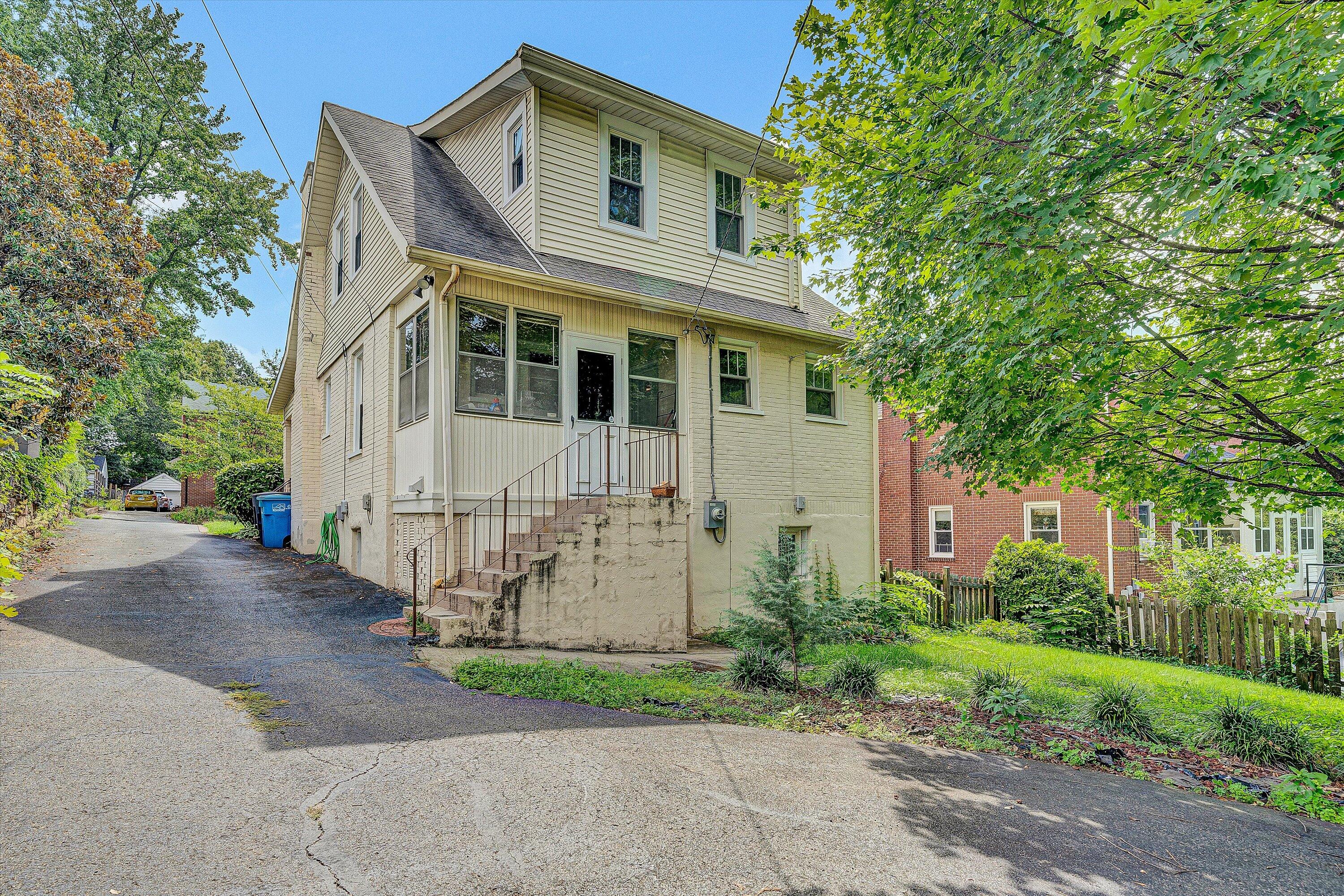 1907 Canterbury Road Southwest Roanoke, VA 24015 - Photo 32 of 36 a front view of a house with garden