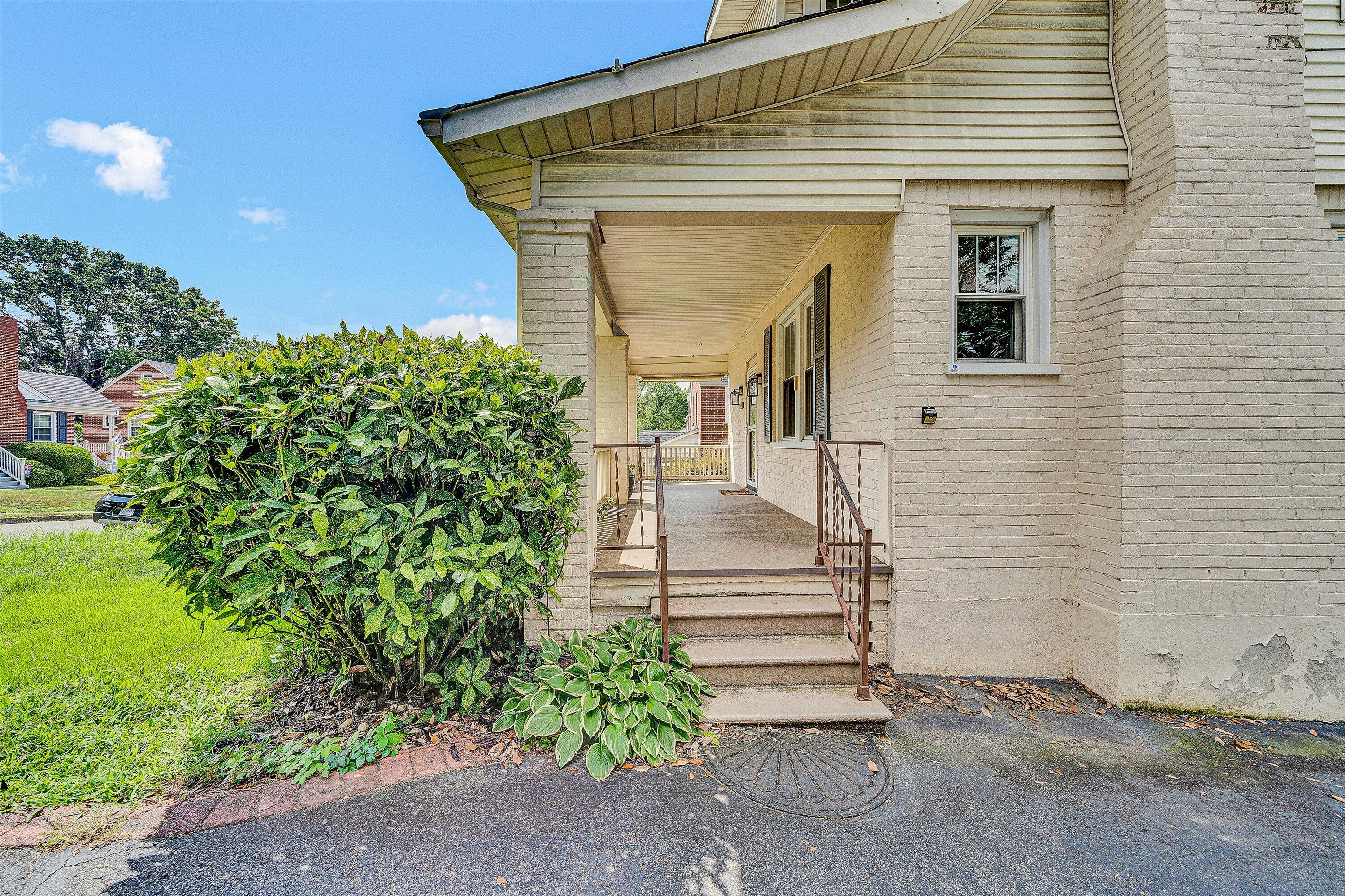 1907 Canterbury Road Southwest Roanoke, VA 24015 - Photo 33 of 36 a front view of a house with a garden