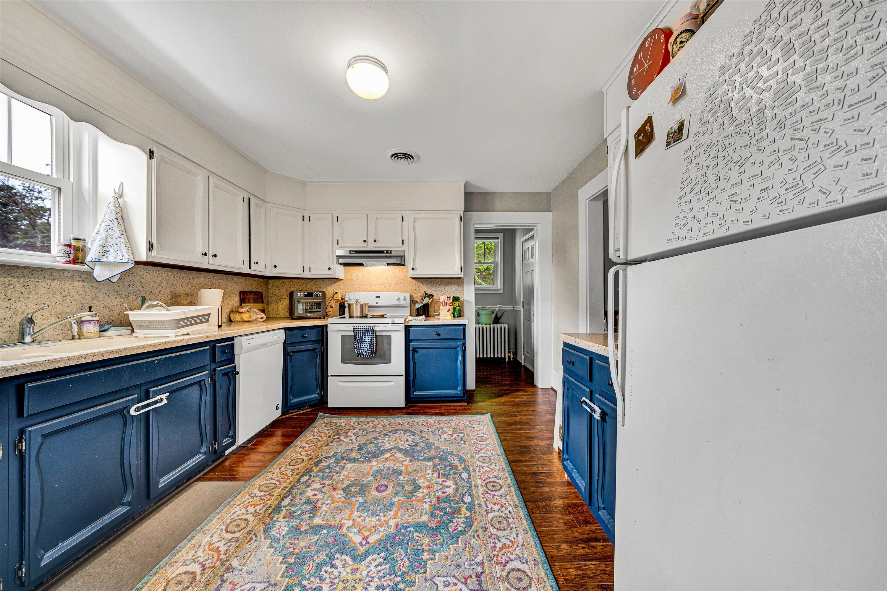 1907 Canterbury Road Southwest Roanoke, VA 24015 - Photo 9 of 36 a kitchen with stainless steel appliances granite countertop a refrigerator sink and wooden cabinets