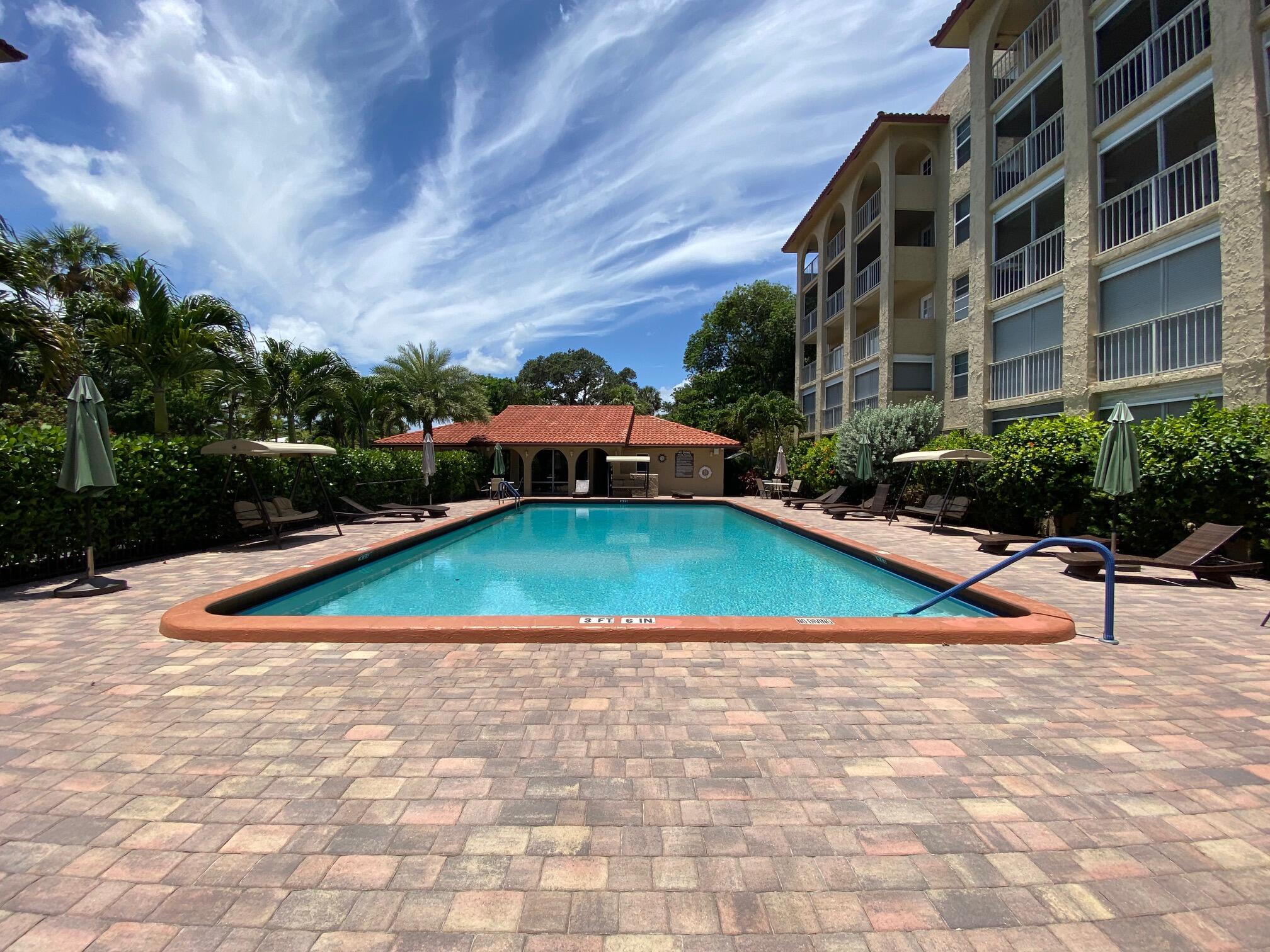 951 De Soto Road, Unit 127 Boca Raton, FL 33432 - Photo 24 of 26 Community Pool and Clubhouse