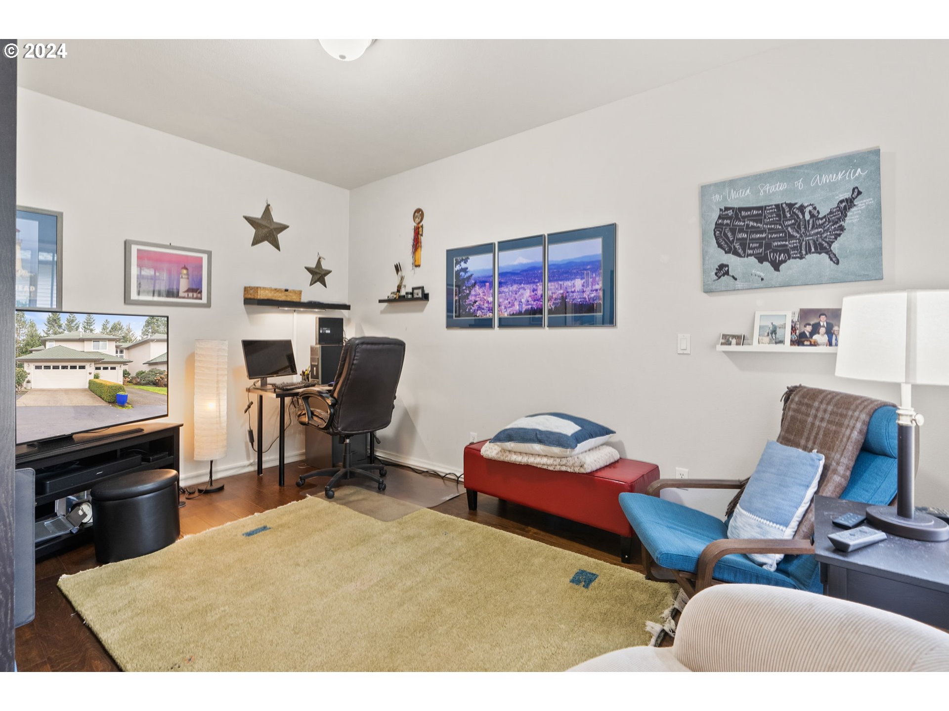22225 Chelan Loop West Linn, OR 97068 - Photo 19 of 46 a workspace with furniture and a flat screen tv