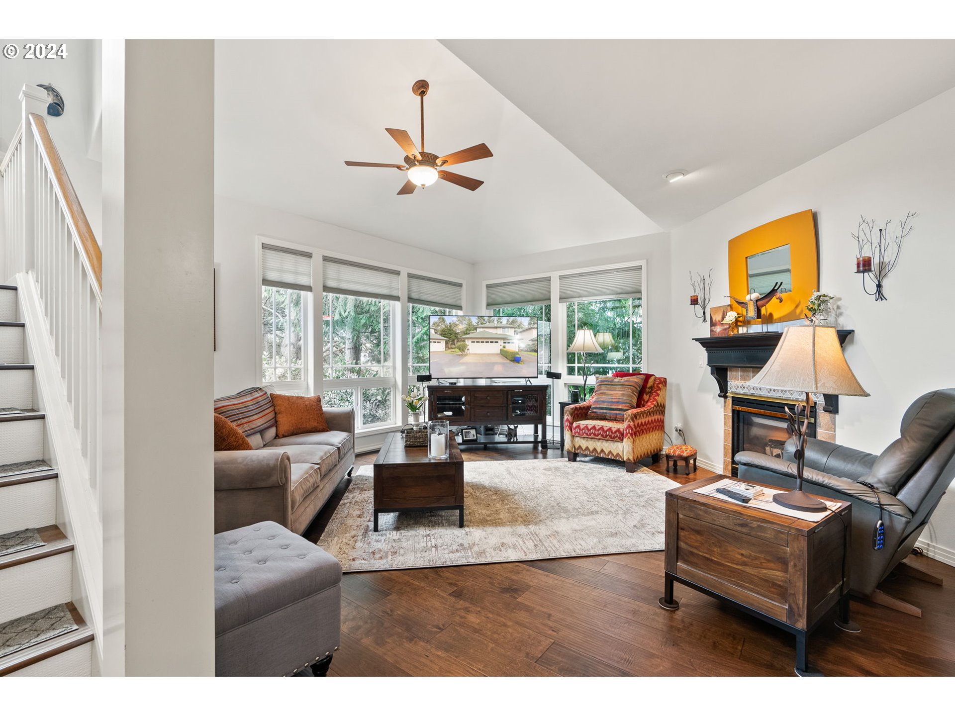 22225 Chelan Loop West Linn, OR 97068 - Photo 20 of 46 a living room with furniture and a flat screen tv
