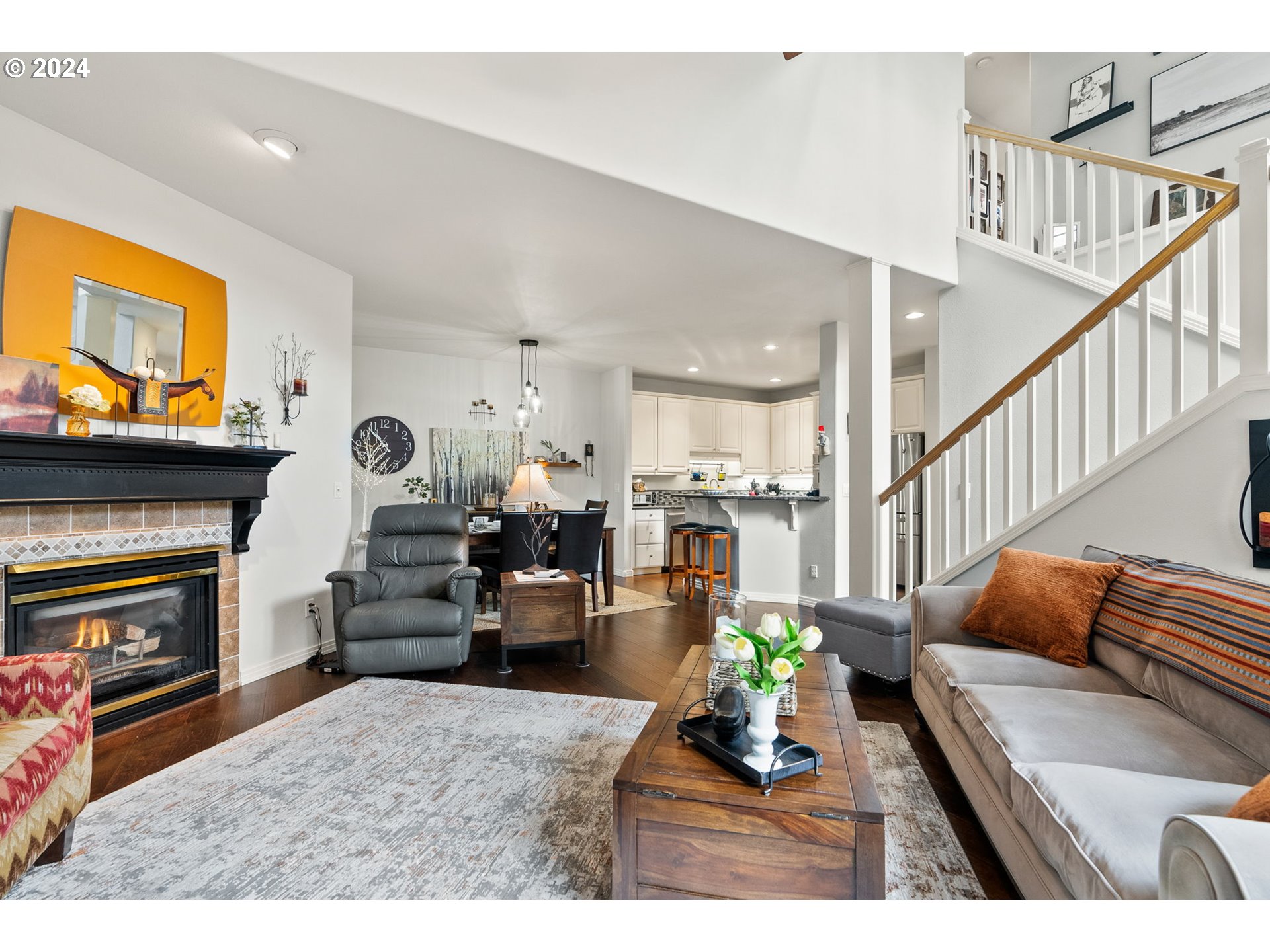 22225 Chelan Loop West Linn, OR 97068 - Photo 25 of 46 a living room with furniture a fireplace and a flat screen tv