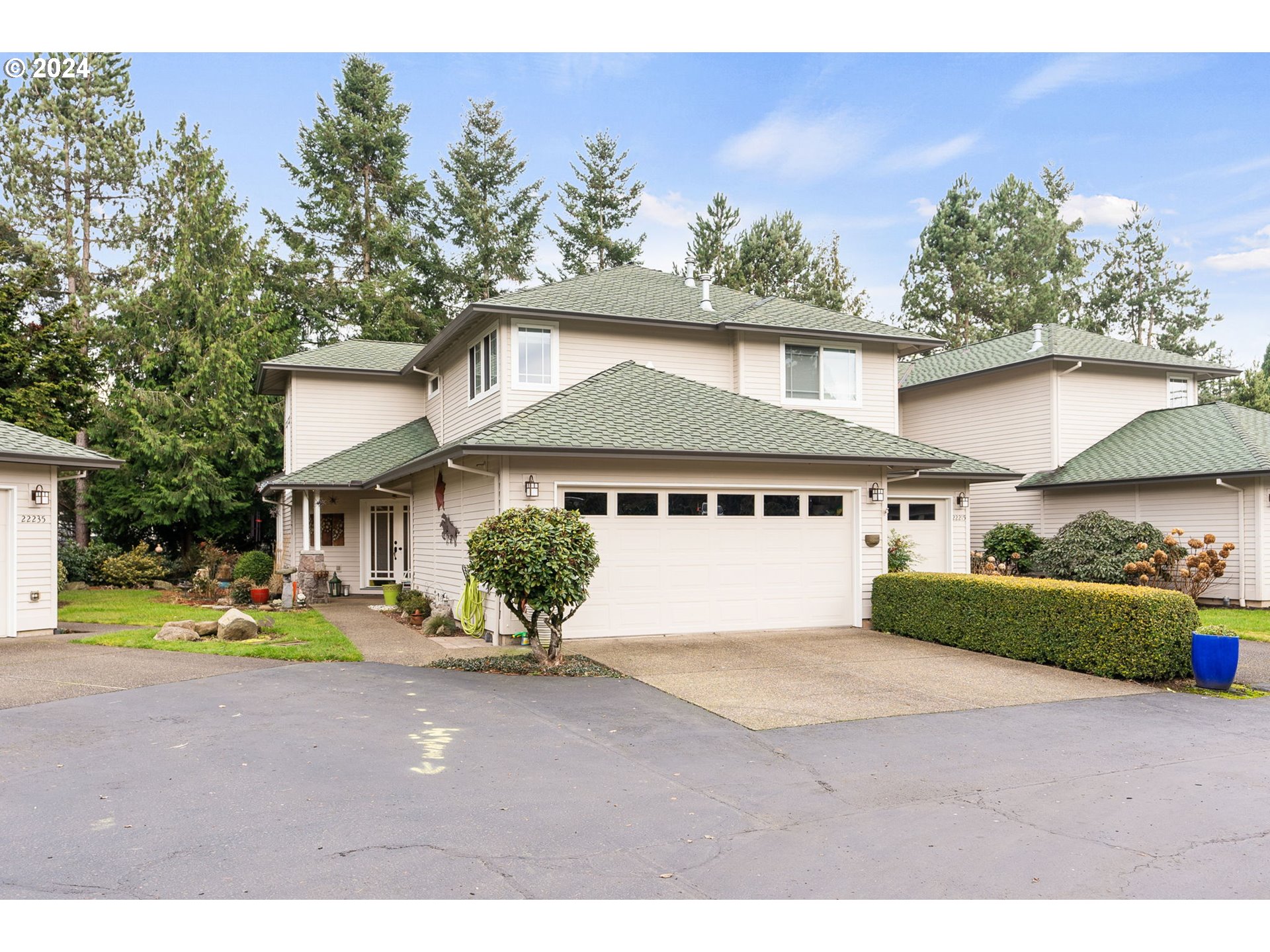 22225 Chelan Loop West Linn, OR 97068 - Photo 3 of 46 a front view of a house with a yard and garage