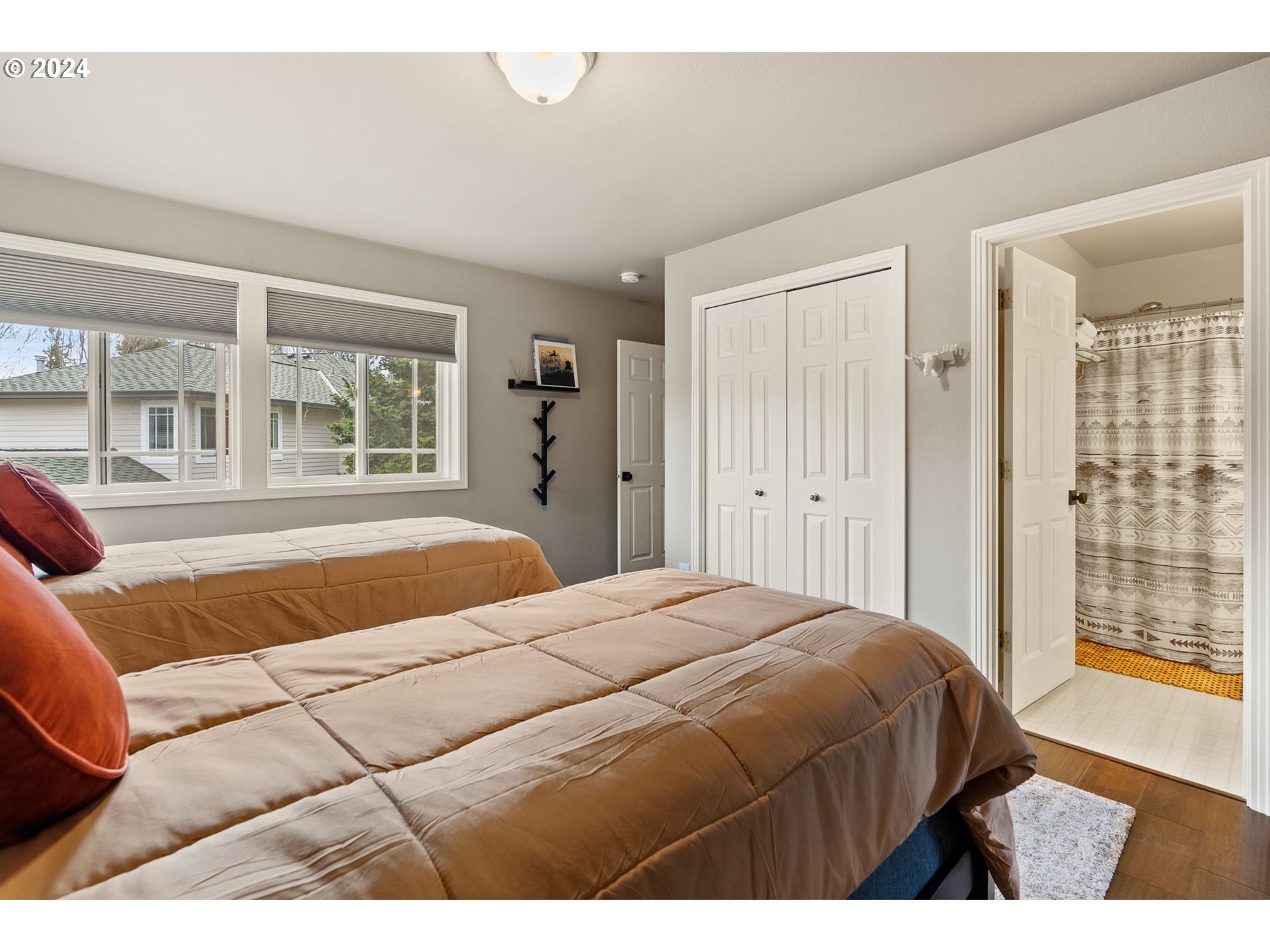 22225 Chelan Loop West Linn, OR 97068 - Photo 34 of 46 a bedroom with a large bed and a couch