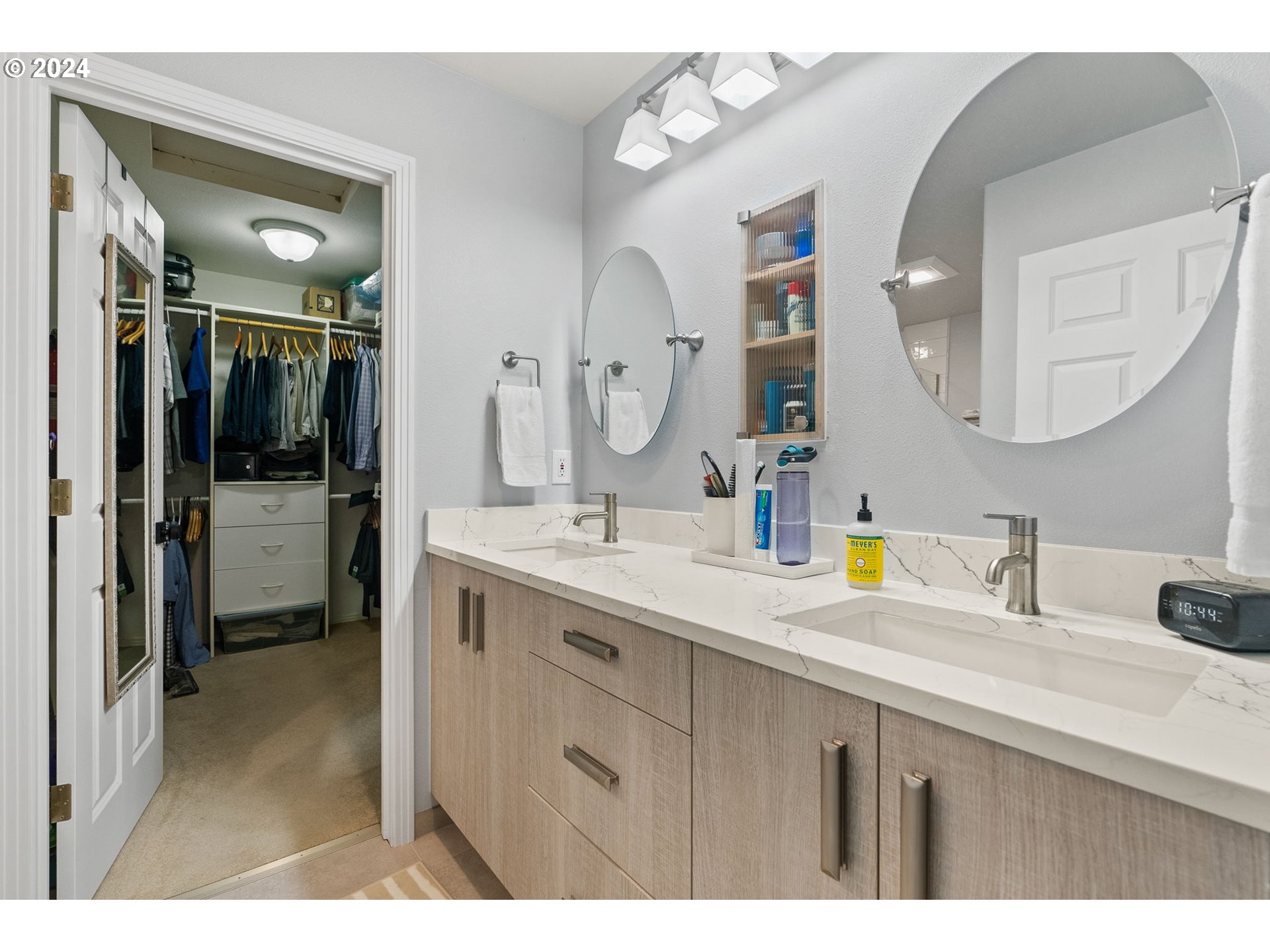 22225 Chelan Loop West Linn, OR 97068 - Photo 42 of 46 a bathroom with a double vanity sink and a mirror