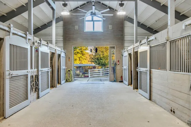 a view of staircase with a swimming pool and glass windows