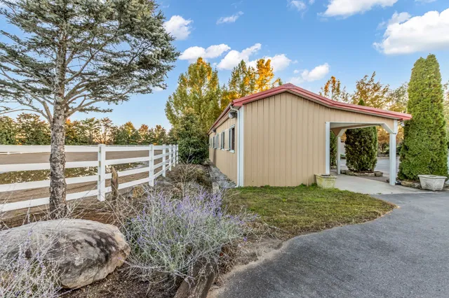 a view of a balcony with table and chairs and wooden floor