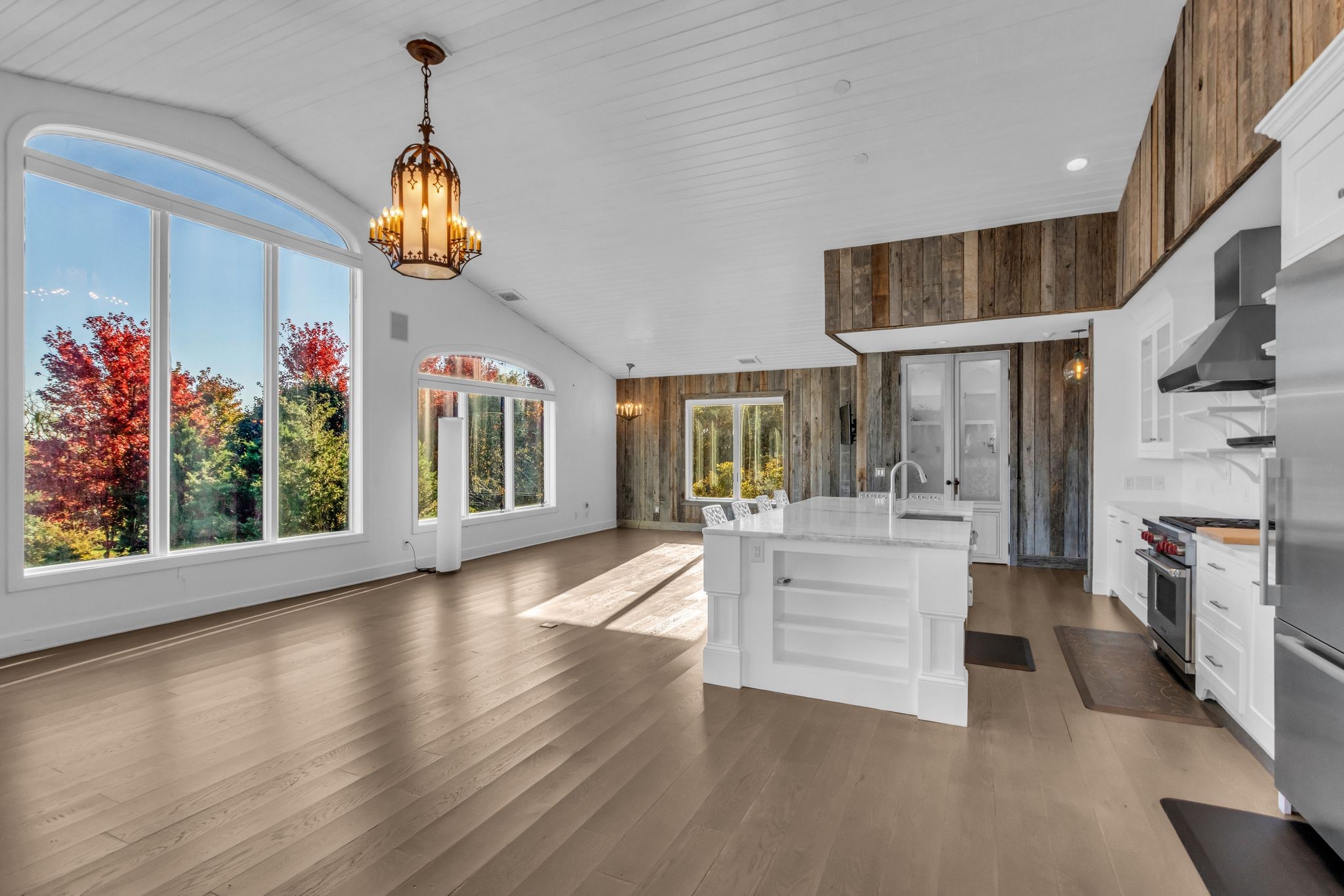 2942 Spanntown Road Arrington, TN 37014 - Photo 42 of 94 a view of a living room and kitchen with furniture wooden floor and windows