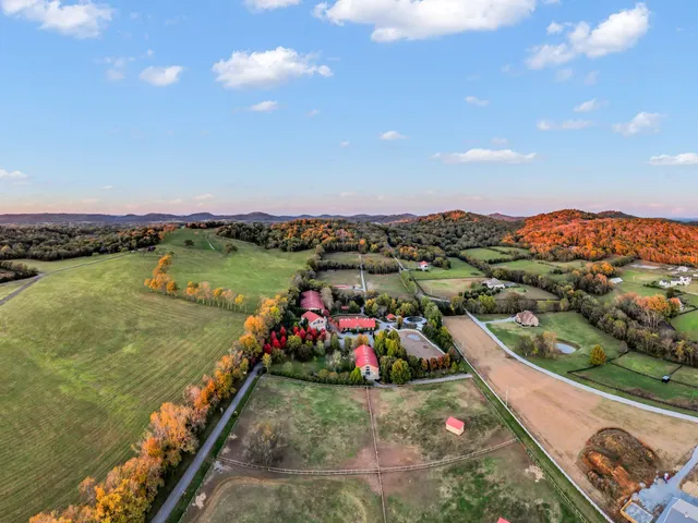 a view of an empty room with a fireplace
