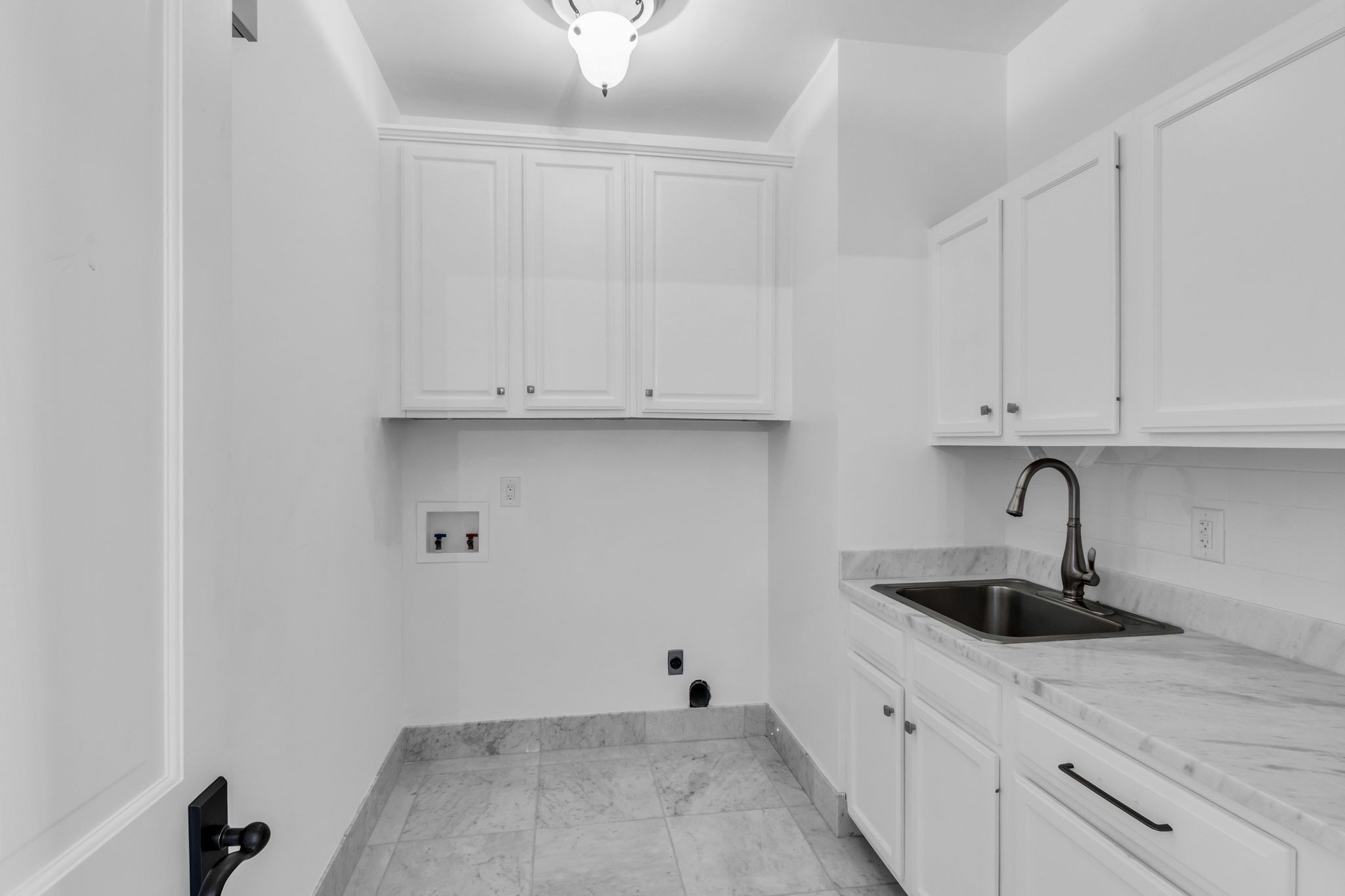 2942 Spanntown Road Arrington, TN 37014 - Photo 71 of 94 a kitchen with white cabinets and sink
