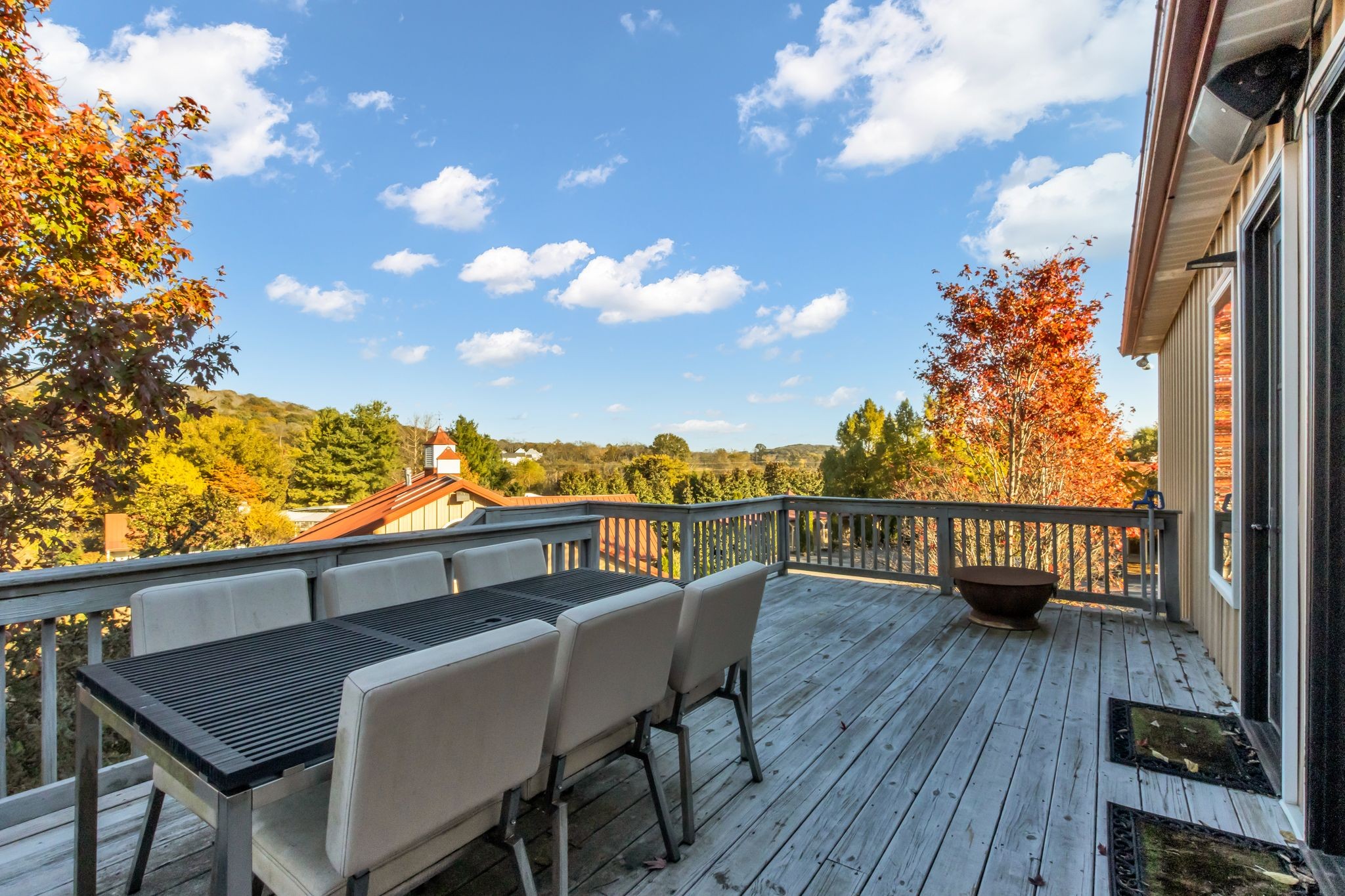 2942 Spanntown Road Arrington, TN 37014 - Photo 73 of 94 a view of a balcony with table and chairs and wooden floor