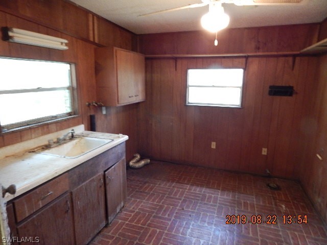 31600 Bermont Road Punta Gorda, FL 33982 - Photo 3 of 23 a bathroom with a sink and a mirror
