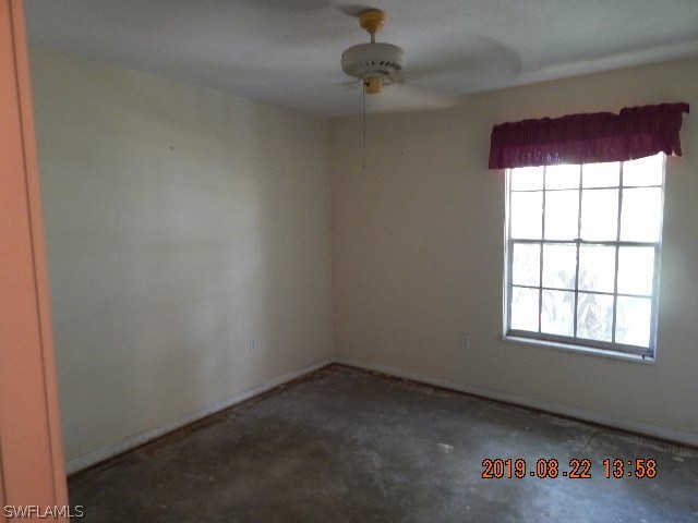 31600 Bermont Road Punta Gorda, FL 33982 - Photo 6 of 23 an empty room with a window