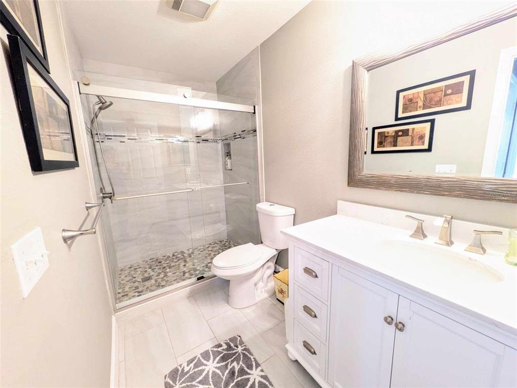 9513 Southwest 92nd Place Road Ocala, FL 34481 - Photo 12 of 16 a bathroom with a sink toilet and shower