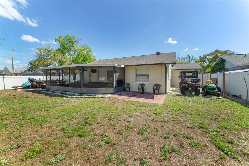 8715 Huntsman Lane Port Richey, FL 34668 - Photo 54 of 54 a view of a house with backyard and sitting area