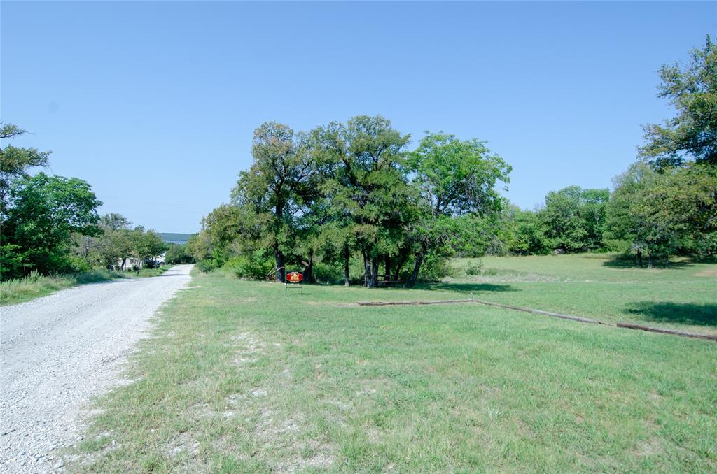 -tbd Lure Street Bridgeport, TX 76426 - Photo 3 of 17 a big yard with lots of green space and trampoline