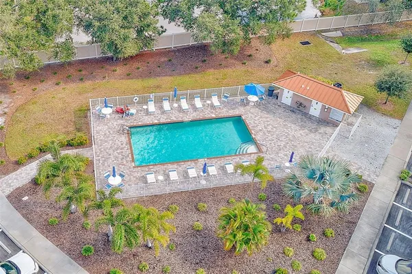 an aerial view of residential houses with city view