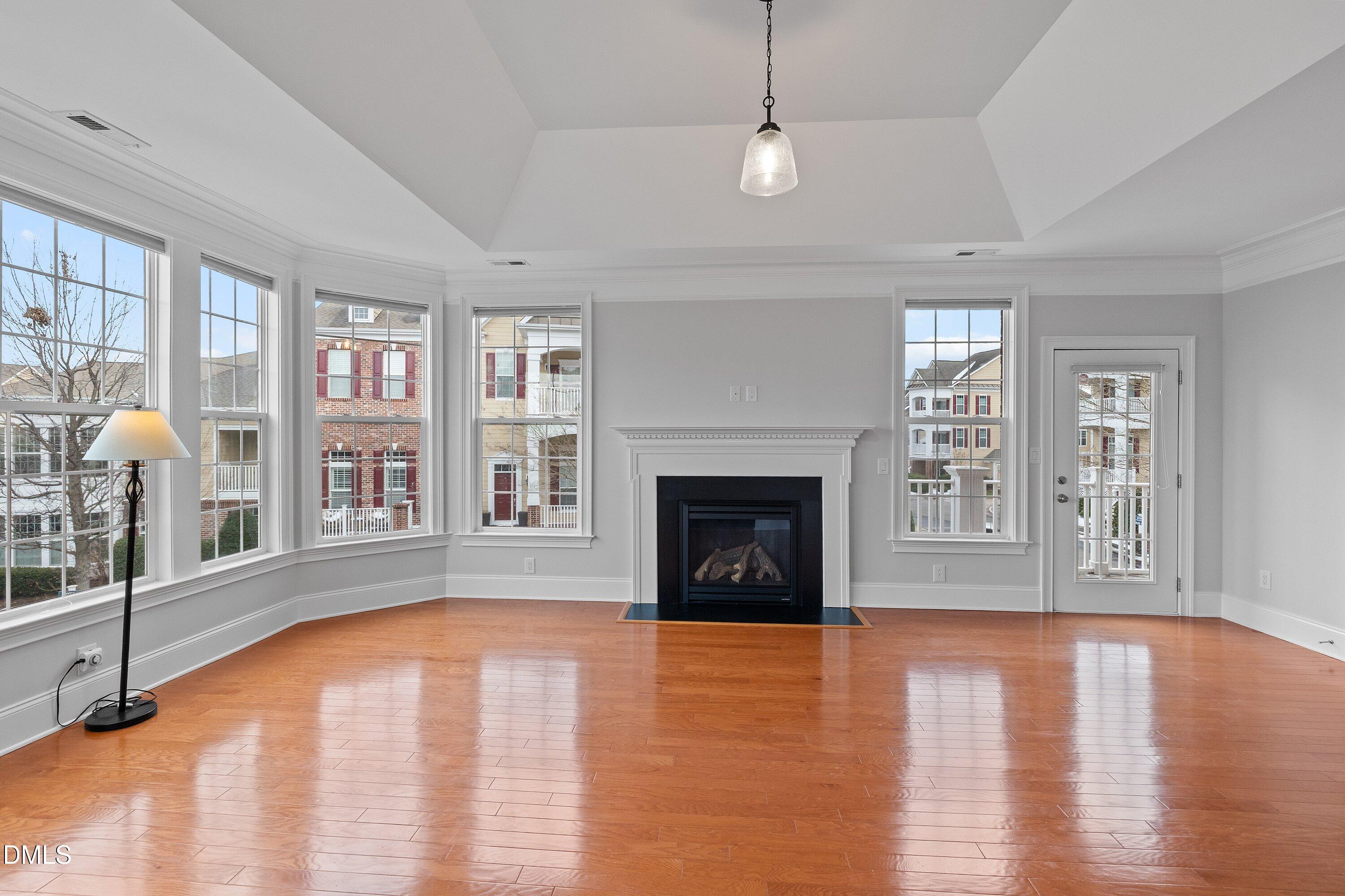9211 Calabria Drive, Unit 205 Raleigh, NC 27617 - Photo 14 of 55 a view of an empty room with window and wooden floor