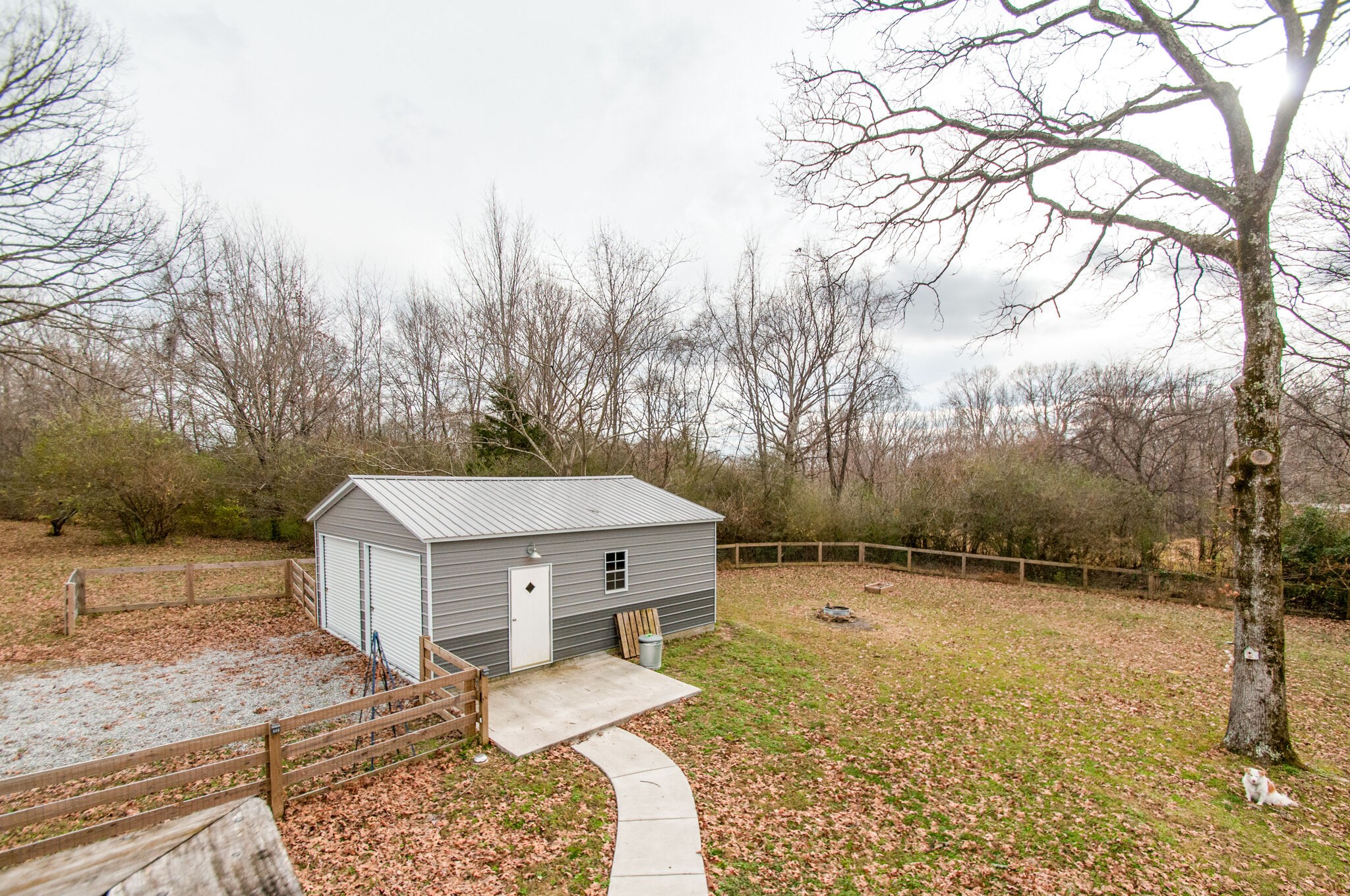 7377 Taylor Road Fairview, TN 37062 - Photo 11 of 22 a view of a house with a yard covered in snow
