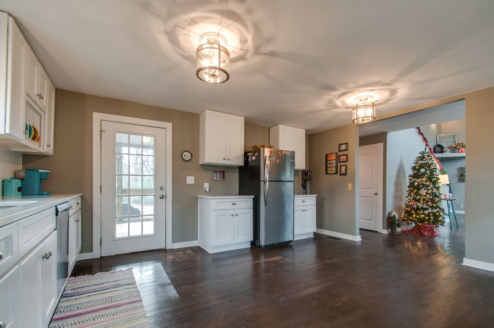 7377 Taylor Road Fairview, TN 37062 - Photo 16 of 22 a view of a kitchen with refrigerator and wooden floor