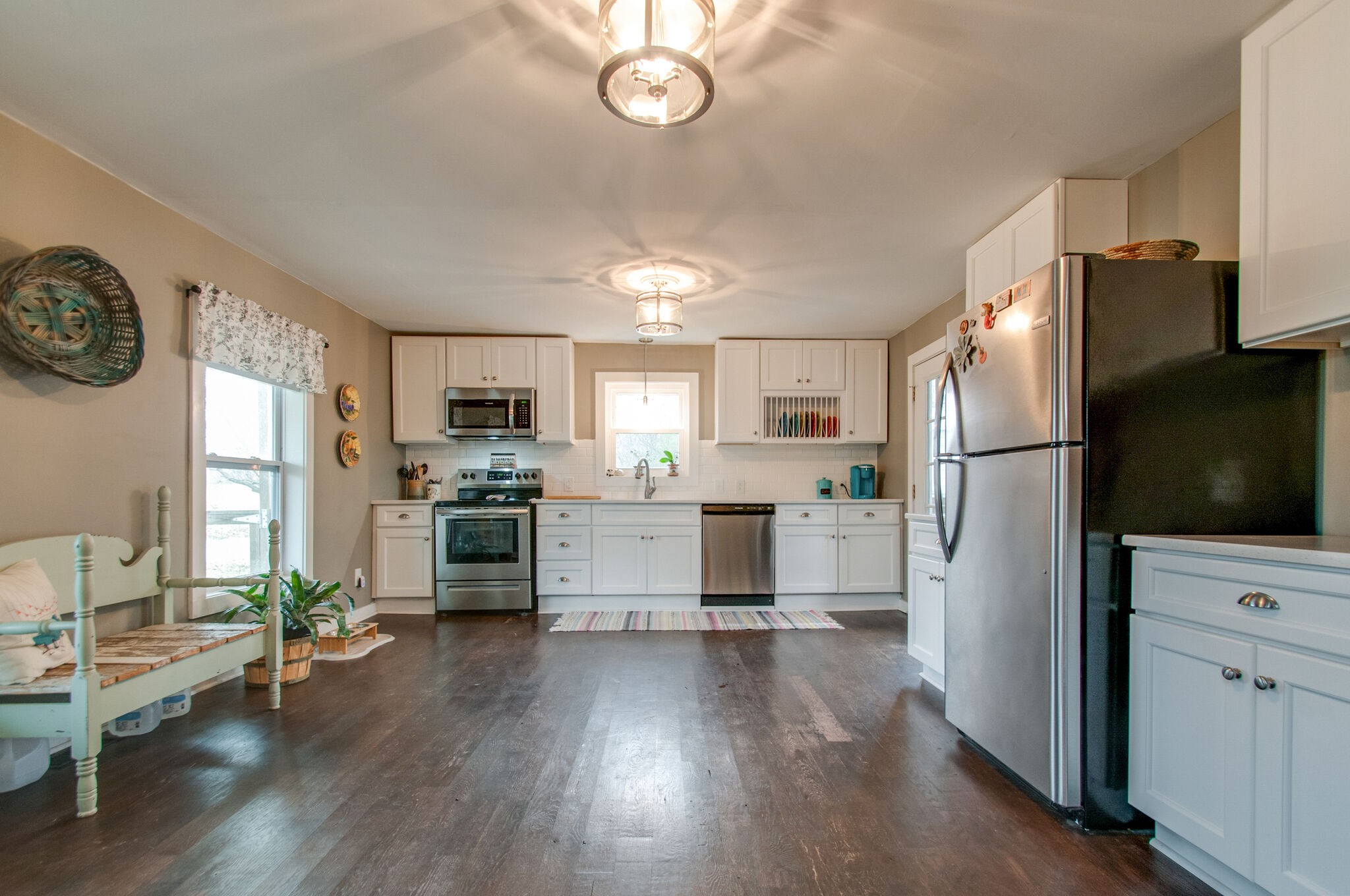 7377 Taylor Road Fairview, TN 37062 - Photo 17 of 22 a view of kitchen with cabinets stainless steel appliances and wooden floor