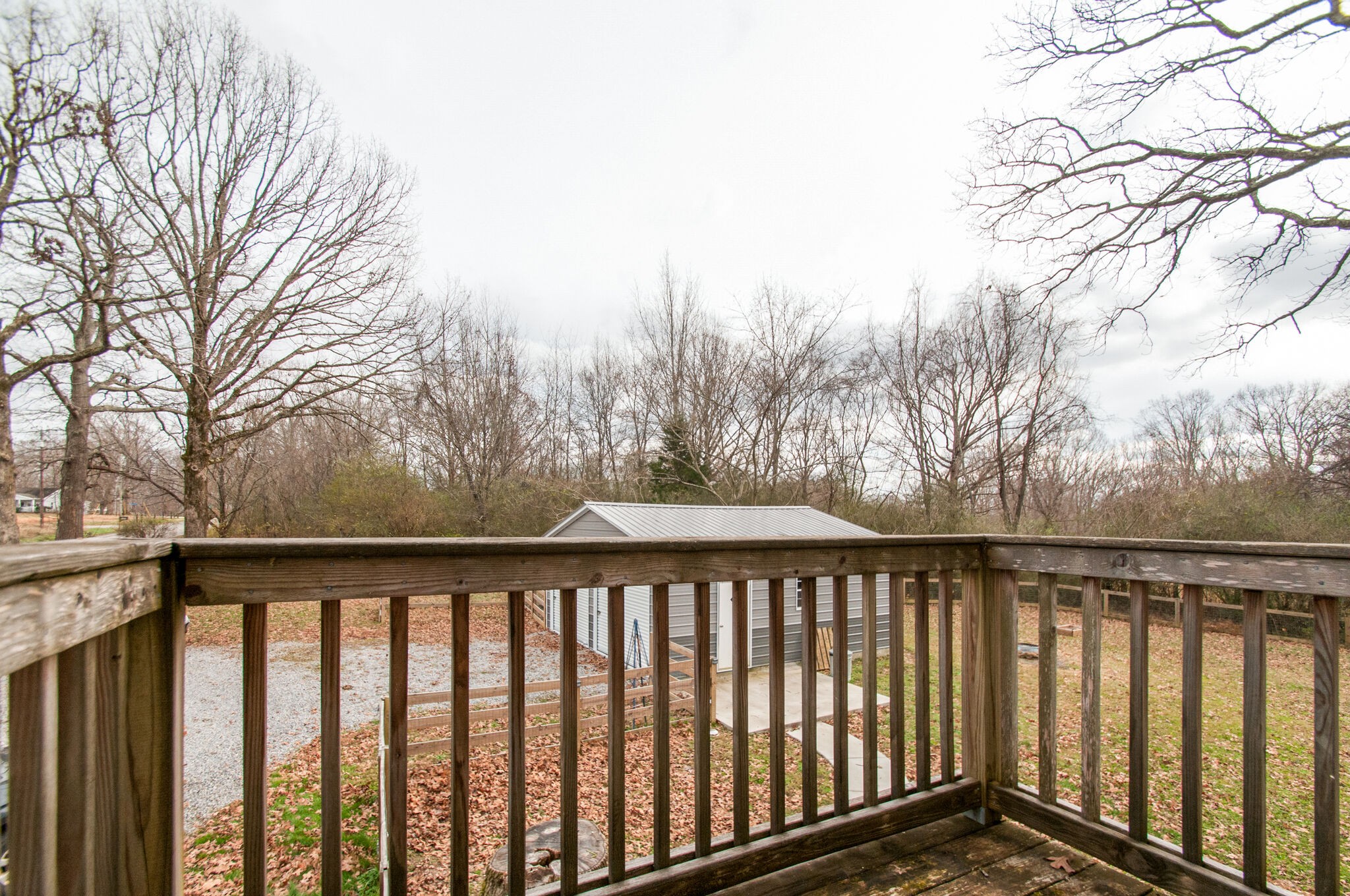 7377 Taylor Road Fairview, TN 37062 - Photo 3 of 22 a balcony with trees in front of it