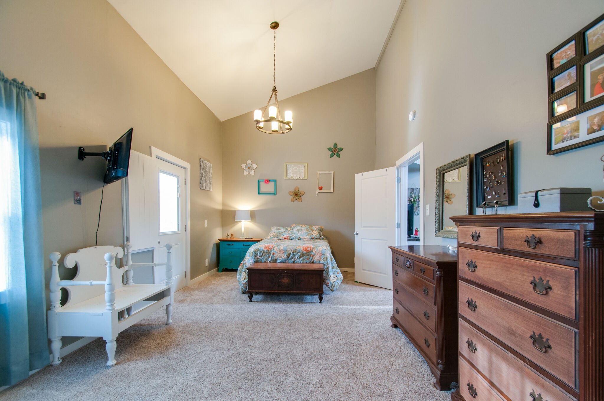 7377 Taylor Road Fairview, TN 37062 - Photo 22 of 22 a spacious bedroom with a bed and a chandelier