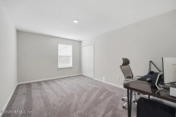 a view of front door and bedroom