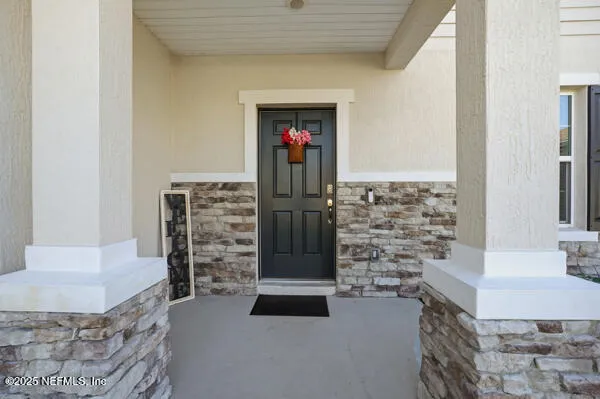 a kitchen with stainless steel appliances granite countertop a refrigerator a oven a sink and a refrigerator