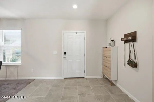 a kitchen with a sink and a large mirror