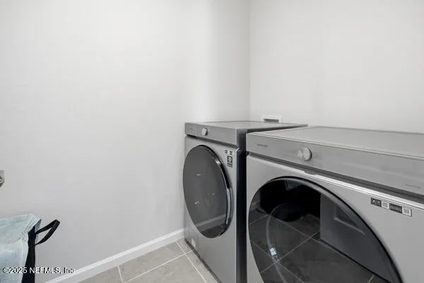 an aerial view of a houses with yard