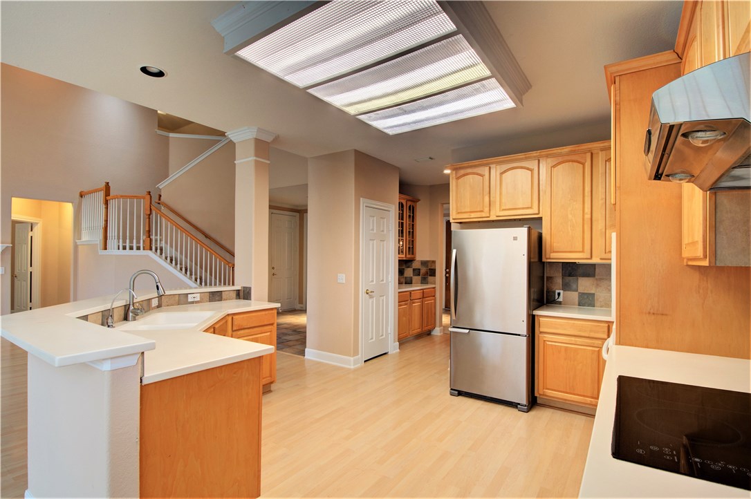 8217 Endeavor Circle Austin, TX 78726 - Photo 13 of 36 a kitchen with stainless steel appliances a refrigerator and a sink