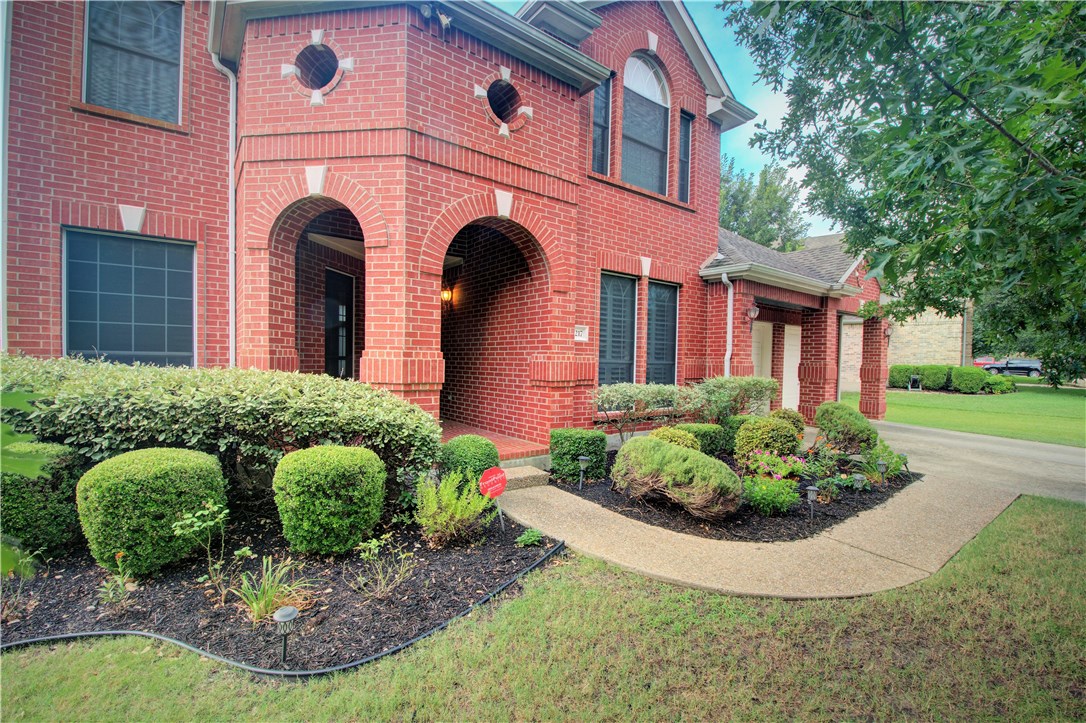 8217 Endeavor Circle Austin, TX 78726 - Photo 2 of 36 a front view of a house with garden