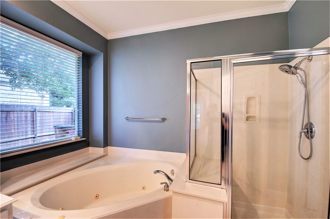 8217 Endeavor Circle Austin, TX 78726 - Photo 25 of 36 a bathroom with a bathtub and a shower