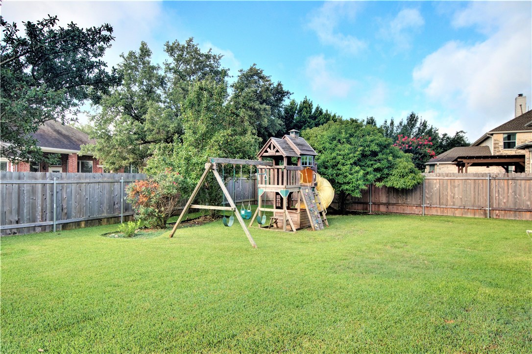 8217 Endeavor Circle Austin, TX 78726 - Photo 33 of 36 a view of a chair and table on the wooden deck