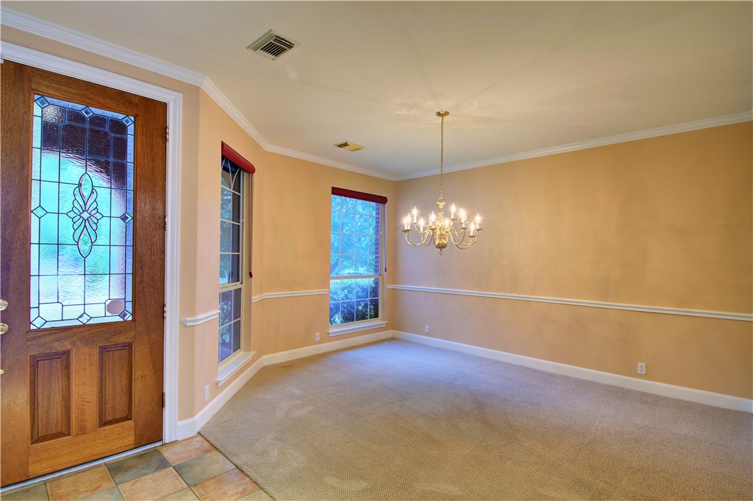 8217 Endeavor Circle Austin, TX 78726 - Photo 4 of 36 a view of a livingroom with a chandelier fan and windows