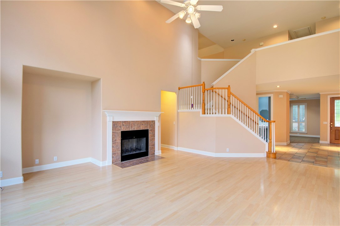 8217 Endeavor Circle Austin, TX 78726 - Photo 10 of 36 a view of a livingroom with an empty room and wooden floor