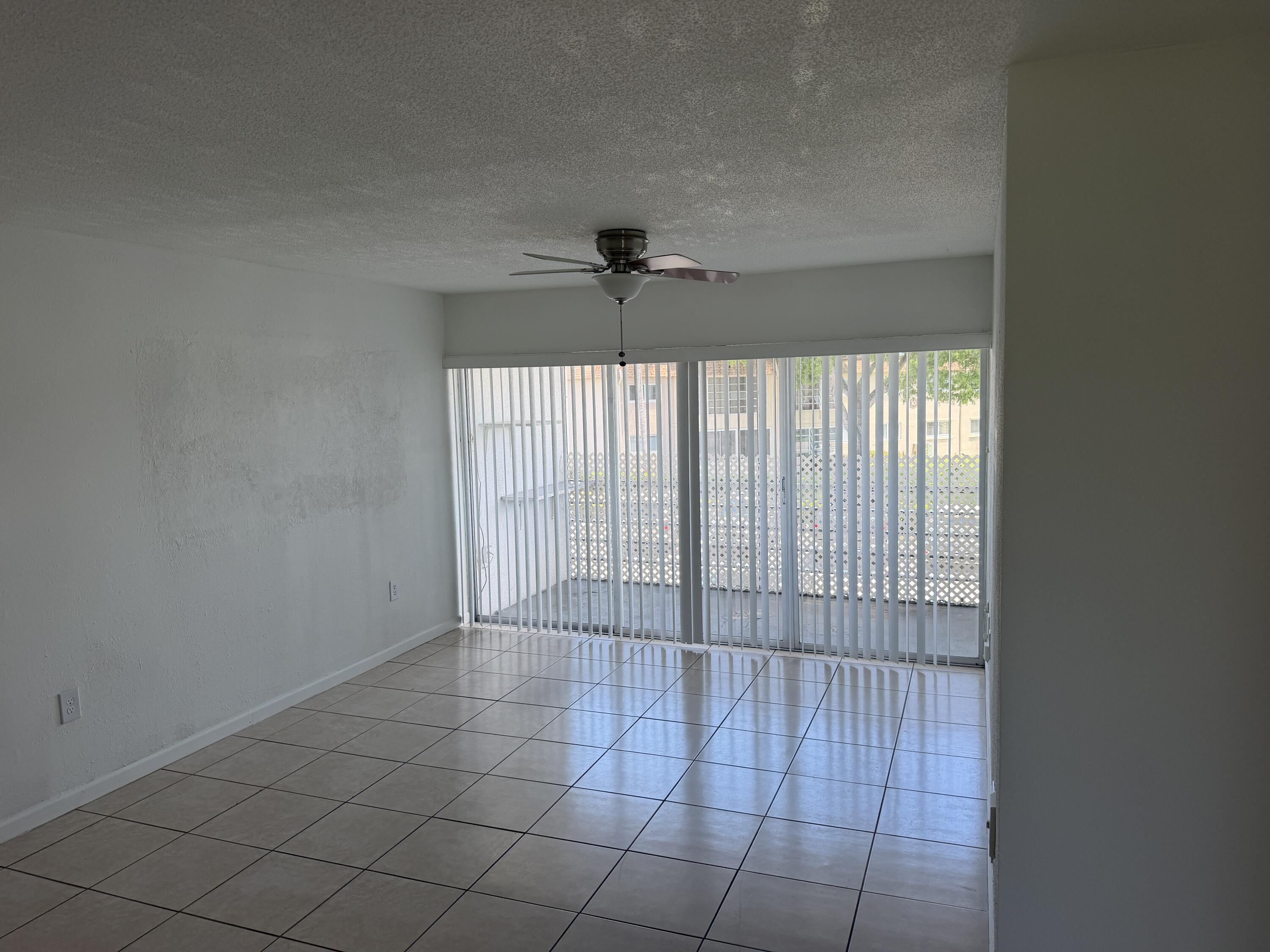 506 Davis Road, Unit 70 Palm Springs, FL 33461 - Photo 17 of 25 a view of an empty room and a window