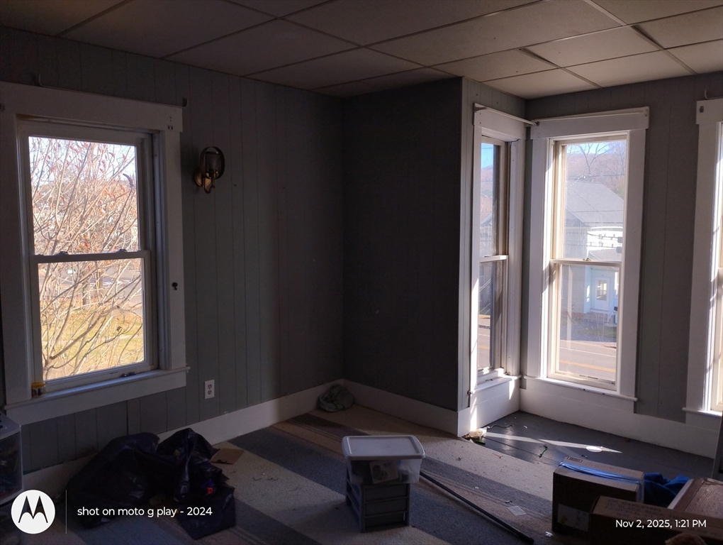 77 West Main Street Ware, MA 01082 - Photo 17 of 17 a living room with furniture and a window