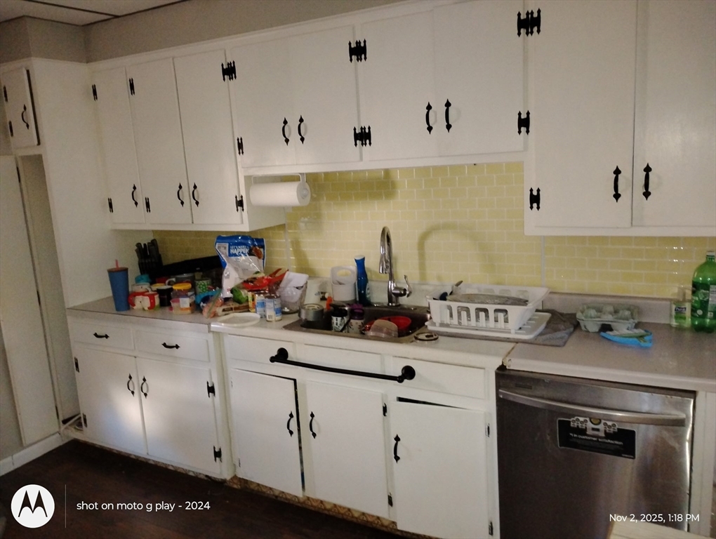 77 West Main Street Ware, MA 01082 - Photo 2 of 17 a kitchen with stainless steel appliances white cabinets and a stove