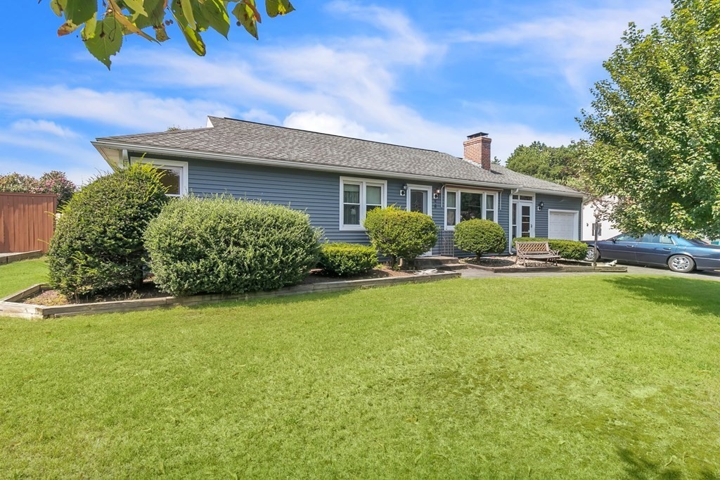 48 Greenlawn Street Springfield, MA 01119 - Photo 1 of 39 a front view of a house with garden