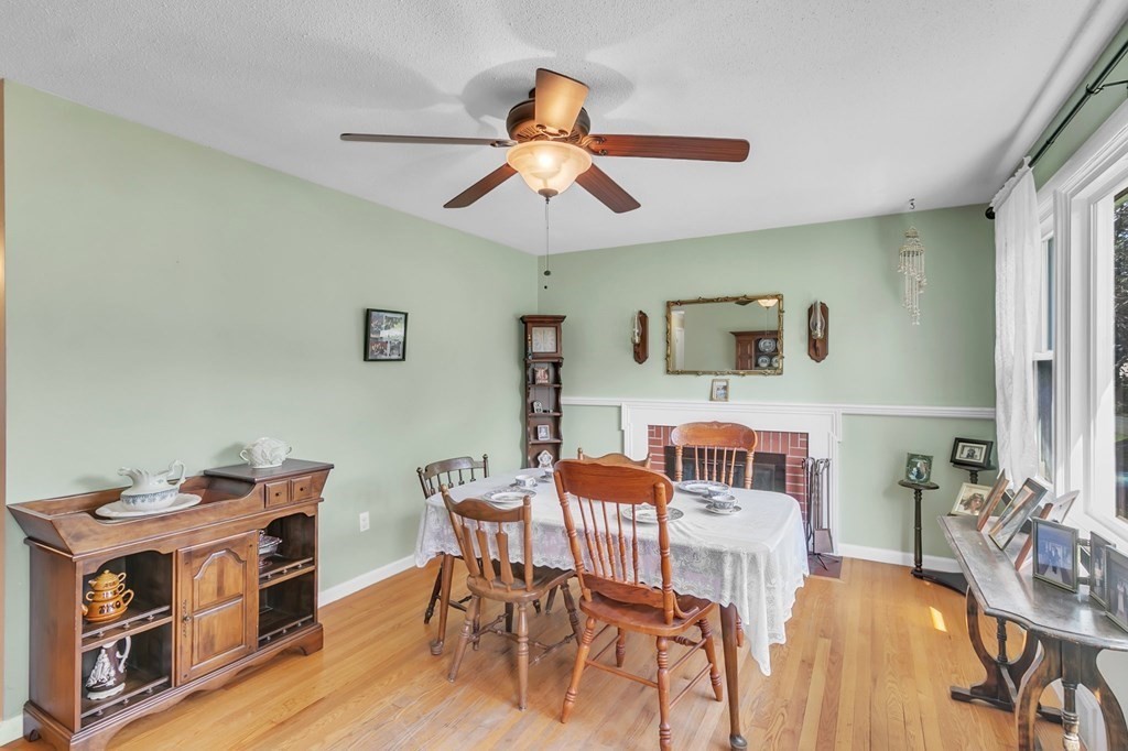 48 Greenlawn Street Springfield, MA 01119 - Photo 11 of 39 a view of a dining room with furniture and wooden floor