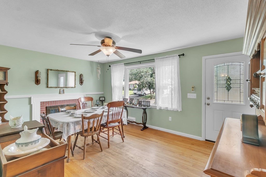 48 Greenlawn Street Springfield, MA 01119 - Photo 12 of 39 a view of a dining room with furniture window and wooden floor