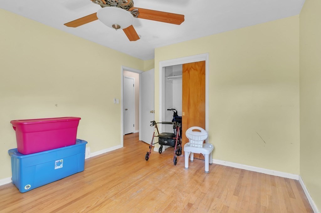 48 Greenlawn Street Springfield, MA 01119 - Photo 15 of 39 a living room with furniture and a wooden floor