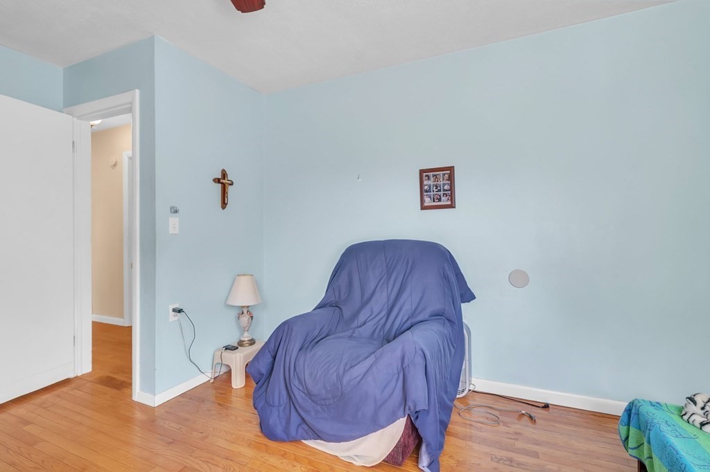 48 Greenlawn Street Springfield, MA 01119 - Photo 16 of 39 a living room with furniture and wooden floor