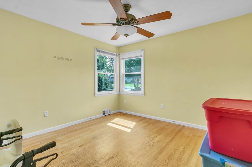 48 Greenlawn Street Springfield, MA 01119 - Photo 32 of 39 a view of a room with a window and a ceiling fan