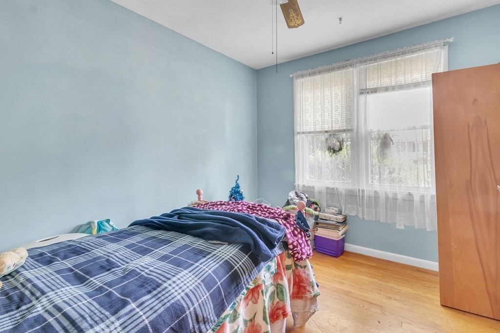 48 Greenlawn Street Springfield, MA 01119 - Photo 33 of 39 a bedroom with a bed and a window